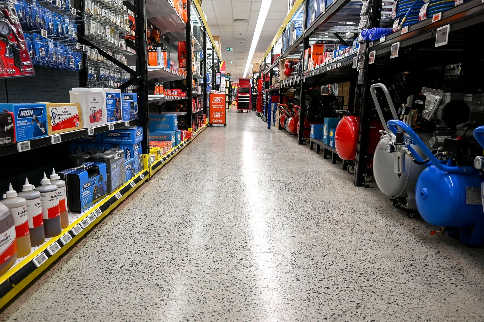 Grind and seal concrete floor with topical coating