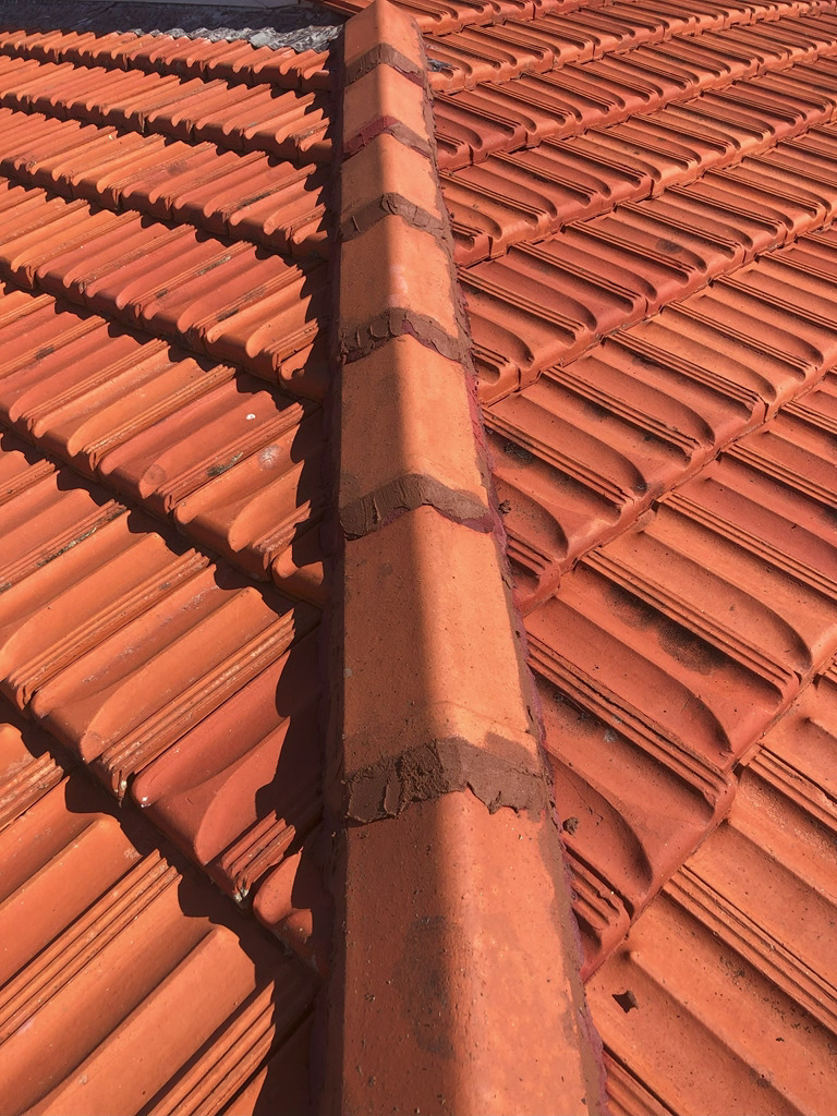 Repaired ridge tile pointing