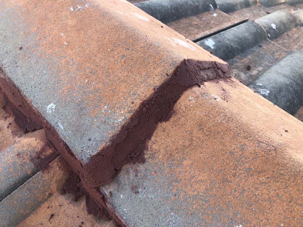 New pointing applied to old roof ridge tiles