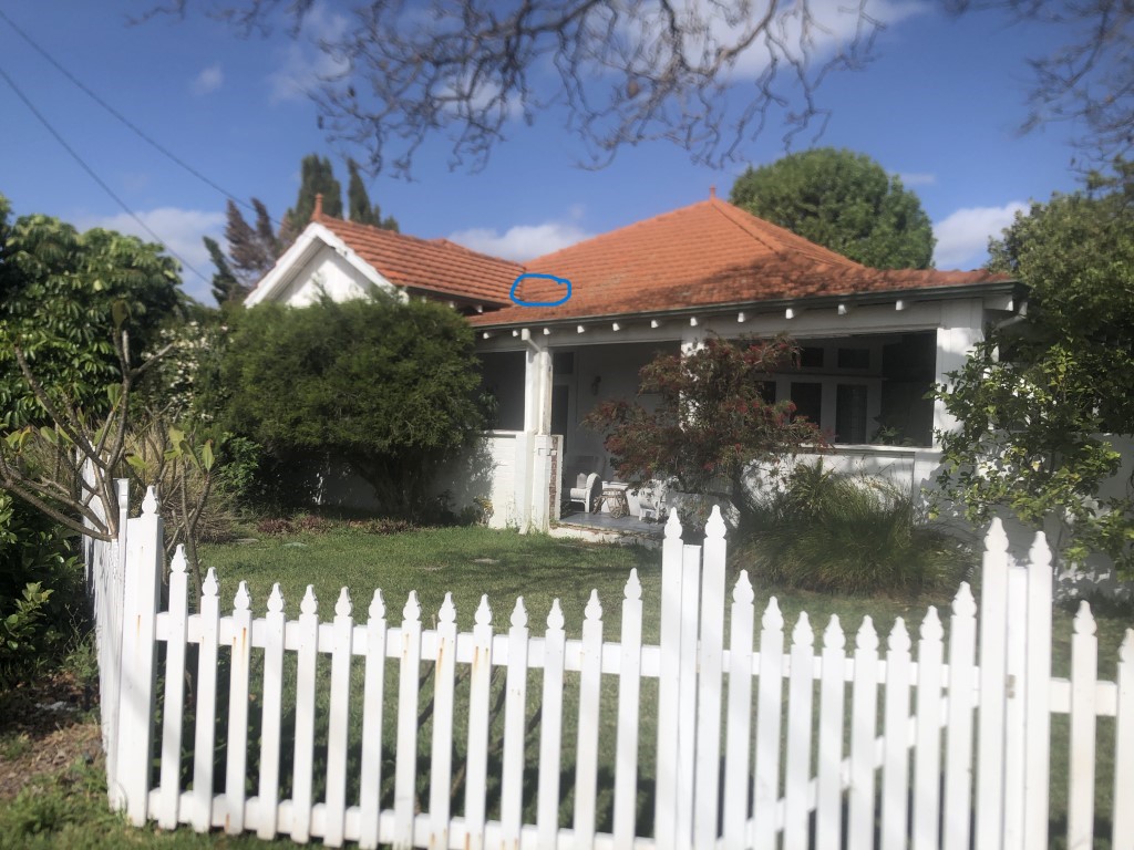 External view of roof indicating location of broken tile