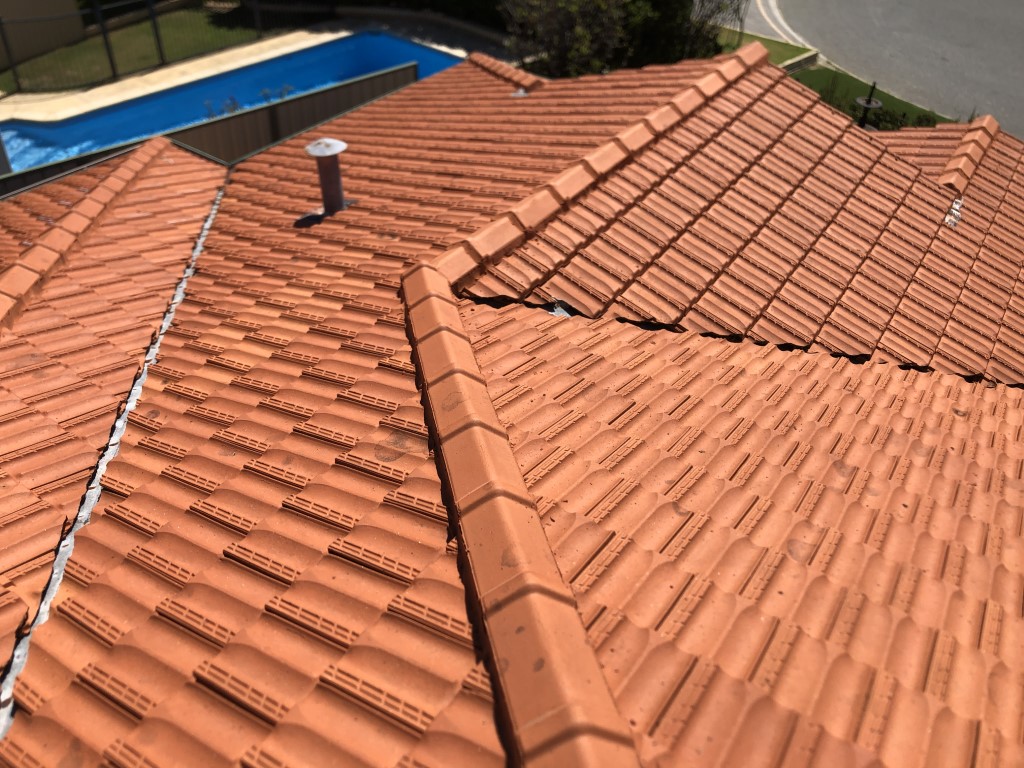 Cleaned terracotta tiled roof. Lichen cleaned off with high pressure washing.