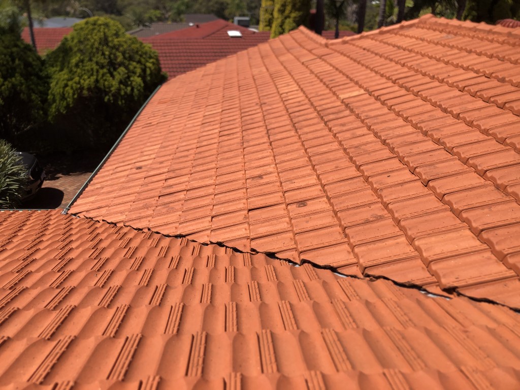 Cleaned terracotta tiled roof. Lichen cleaned off with high pressure washing.