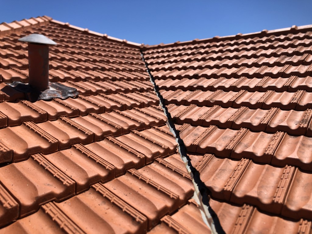 Cleaned terracotta tiled roof. Lichen cleaned off with high pressure washing.